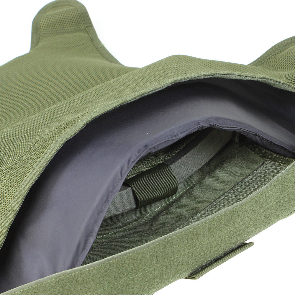 Close-up view of an open green tactical backpack showing the inner compartment and zippers, similar in design to a Spartan Armor Systems Condor Defender Plate Carrier.