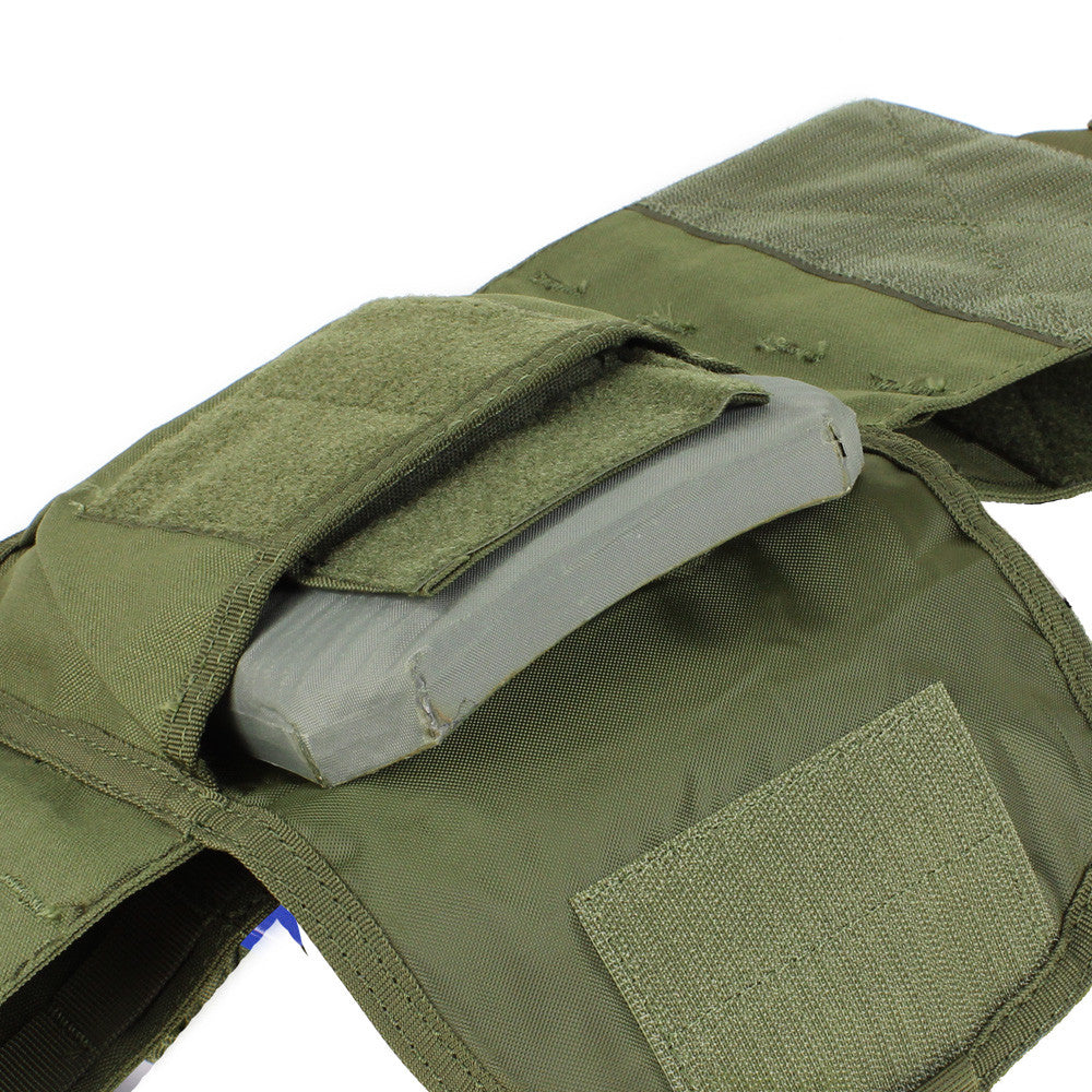 Spartan Armor Systems Condor Defender Plate Carrier with open velcro pockets revealing gray plate inserts, set against a white background.