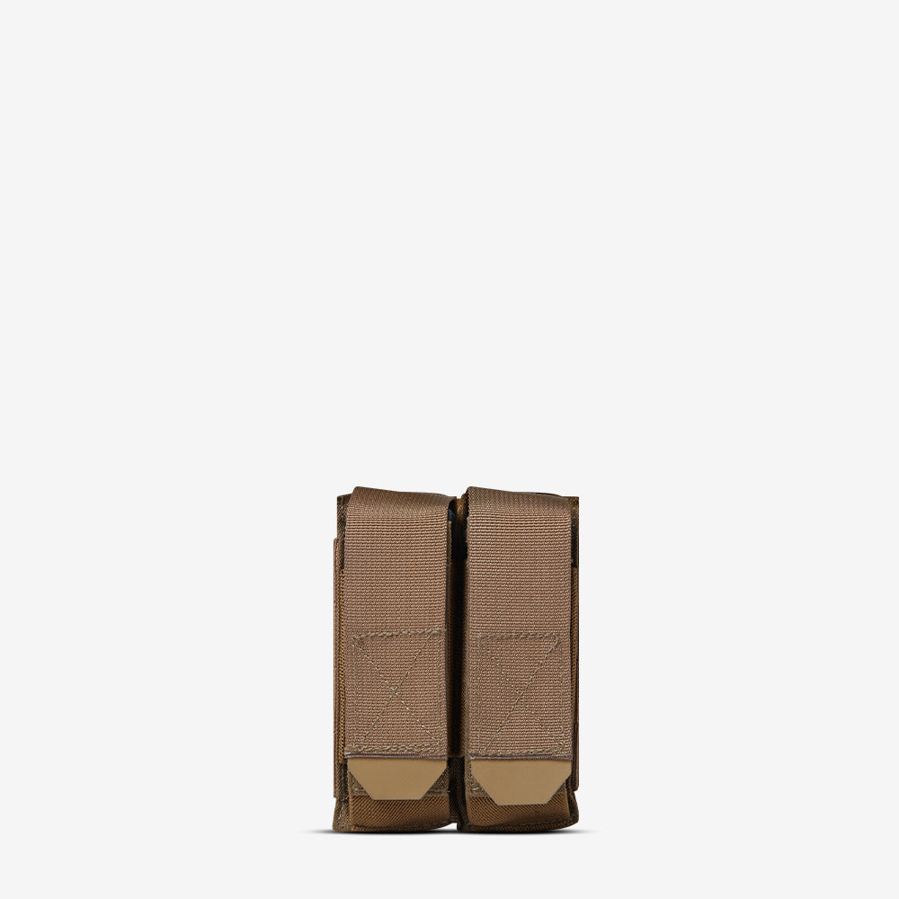 A pair of AR500 Armor Multi-Caliber Pistol Magazine Single Pouches (MCPMP) in brown leather on a white background.