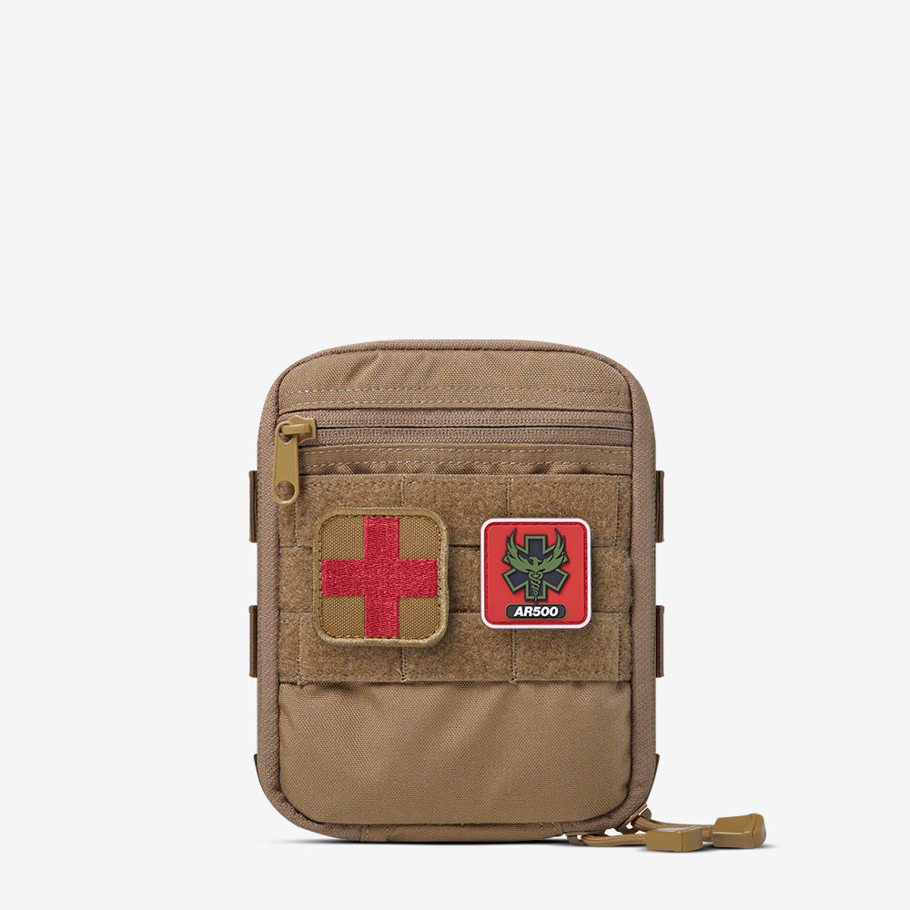 An AR500 Armor Individual First Aid Kit (IFAK) with a red cross on it.