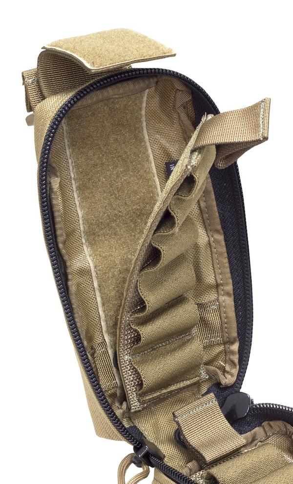 Open Elite Survival Systems tactical backpack displaying its empty interior compartments and zippers, equipped with a Elite Survival Systems Velcro Attach Speed Strip shotgun shell holder, isolated on a white background.