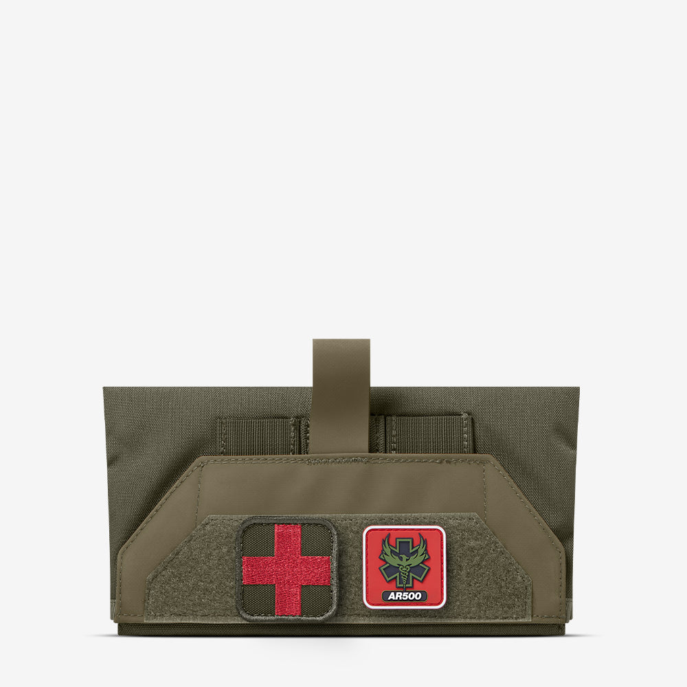 An AR500 Armor green pouch with a red cross on it.