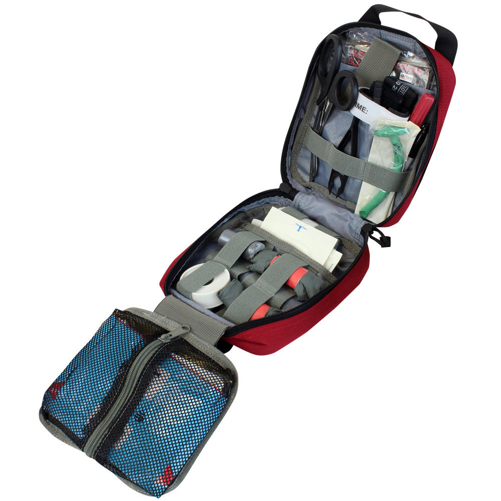 An open Spartan Armor Systems Condor Rip-Away EMT Pouch with a tri-fold design, containing various medical supplies neatly arranged inside, including bandages, scissors, and bottles, displayed against a white background.