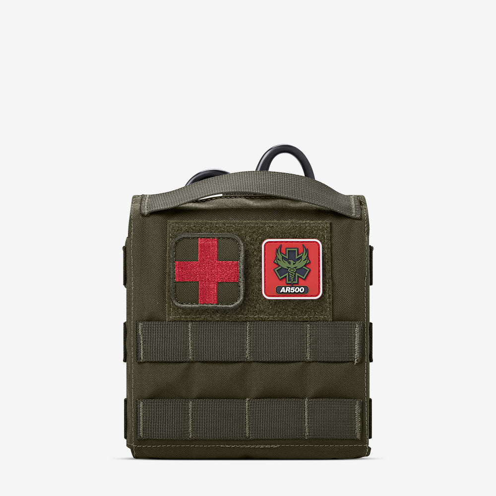 A AR500 Armor Quick Detach IFAK (QD IFAK) medical bag with a red cross on it.