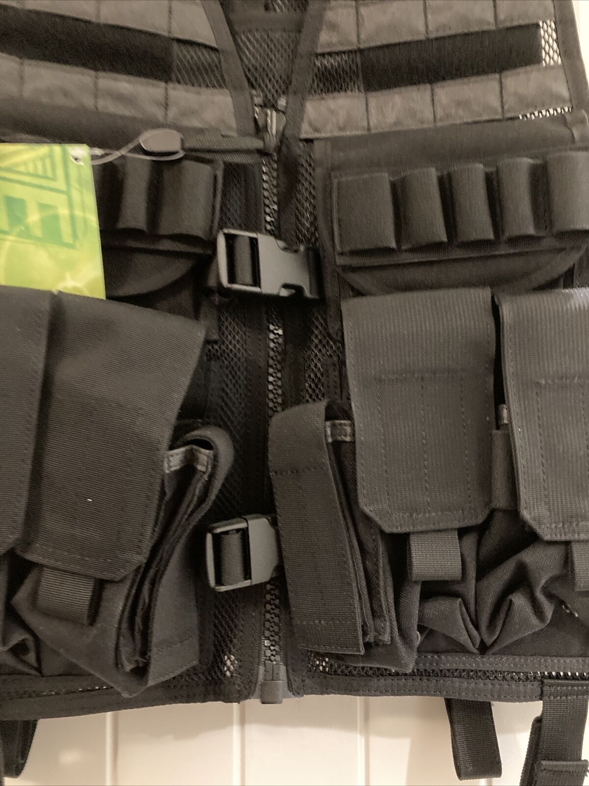 An Elite Survival Systems MVP Payload Tactical Vest with a lot of pockets on it.