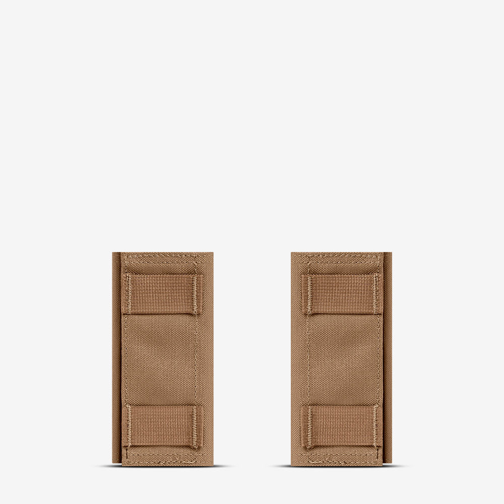 Two AR500 Armor tan leather wallets on a white background.