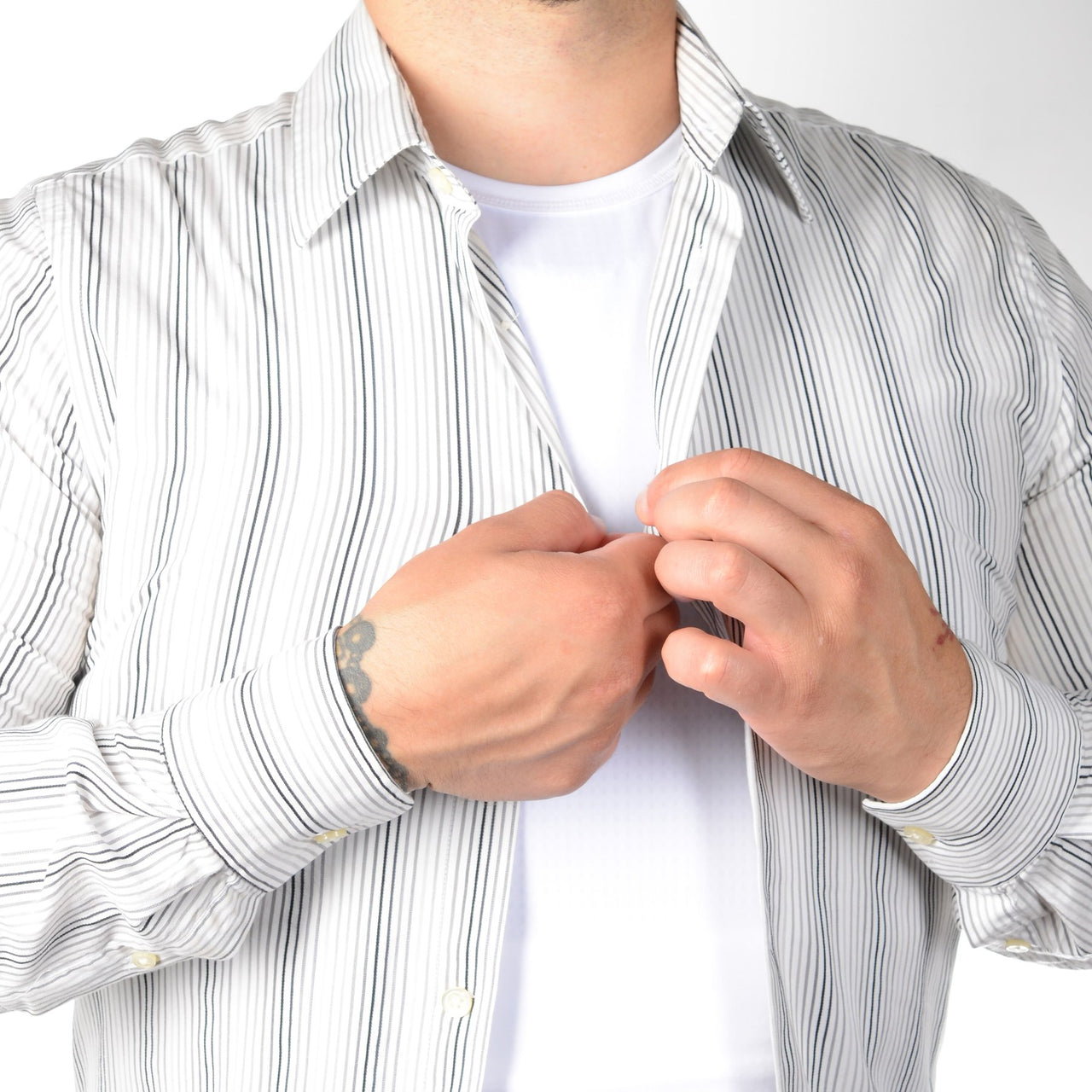 A man wearing a Body Armor Direct VIP T-Shirt Concealable Carrier shirt.